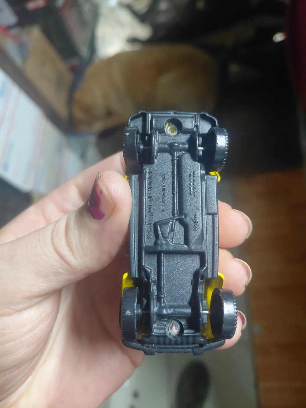 yellow 2015 Jeep Wrangler Unlimited toy car is a 1/64 scale diecast model produc